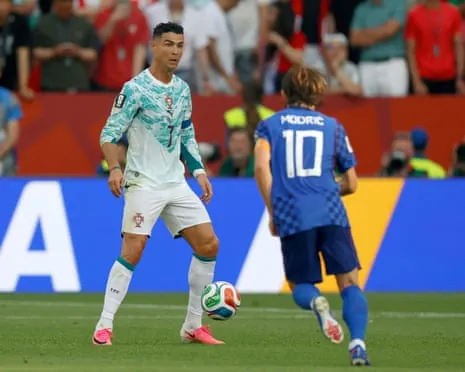 Cristiano Ronaldo and Luka Modrić fight for the ball during in an entertaining opening half in Toronto.