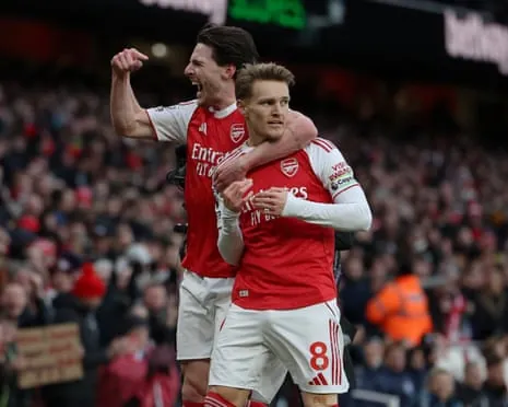 Declan Rice celebrates alongside Arsenal teammate Martin Ødegaard
