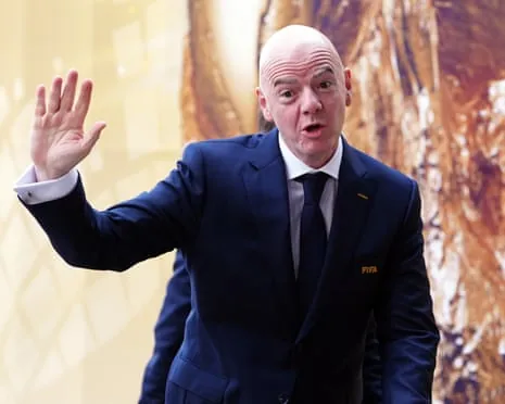Gianni Infantino waves on the day of the World Cup final